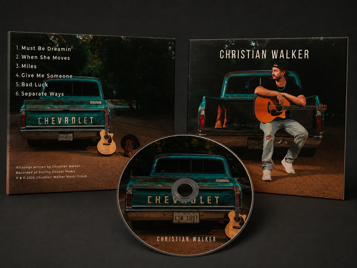 Christian Walker CD album cover and disc shown on a dark background, featuring a teal Chevrolet truck and a seated musician holding an acoustic guitar on the cover art.